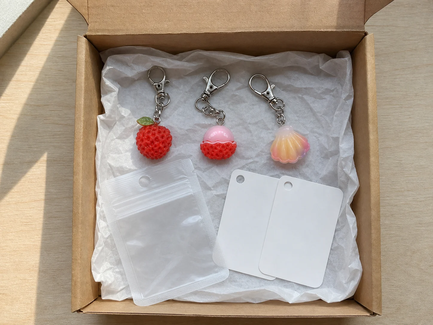 Keychain retail kit unboxing concept with hardware, themed charms and presentation packaging
