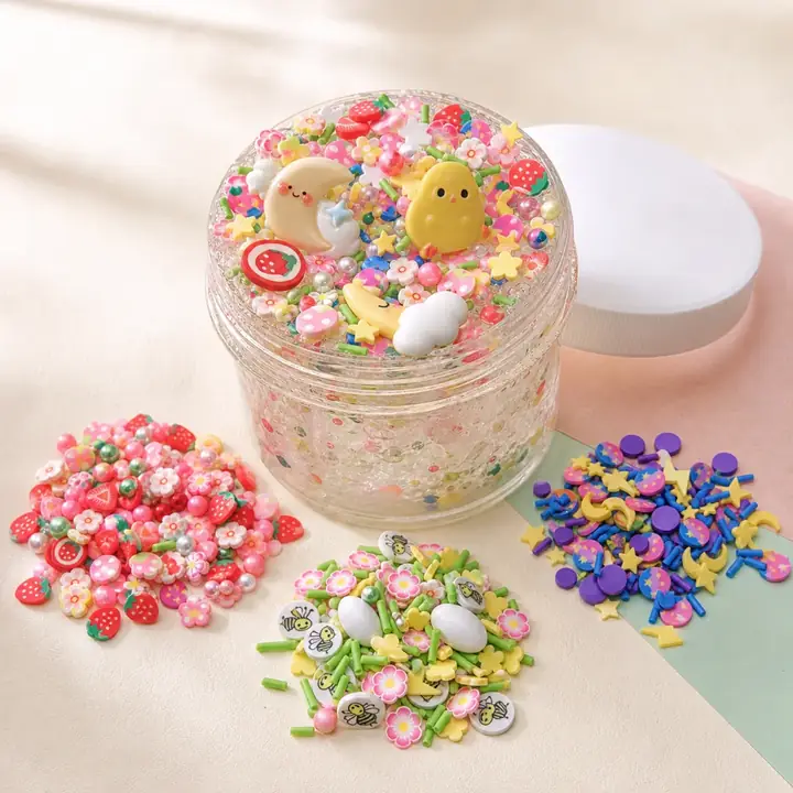 Finished slime jar with floral, celestial, and strawberry charm mixes
