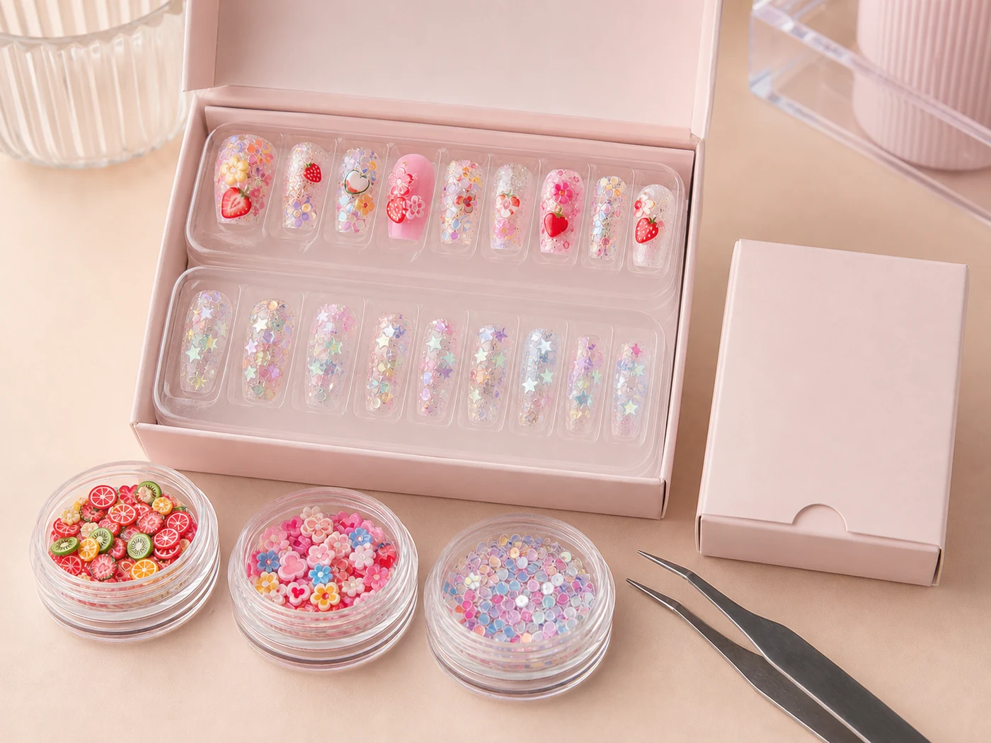 Two completed press-on nail art sets in retail trays with matching mini slices and sequins
